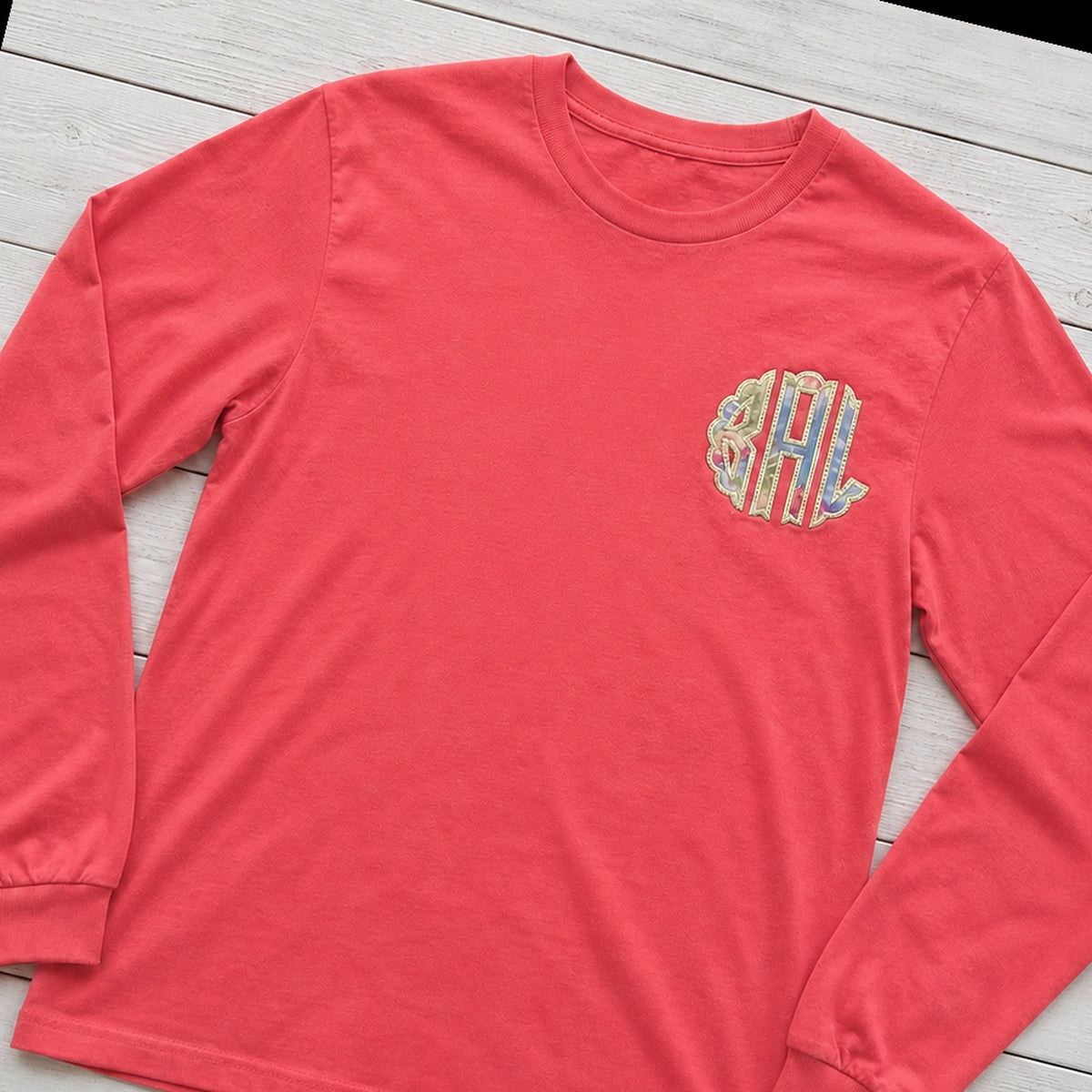 Custom pastel stripe chest monogram long sleeve shirt folded flat lay