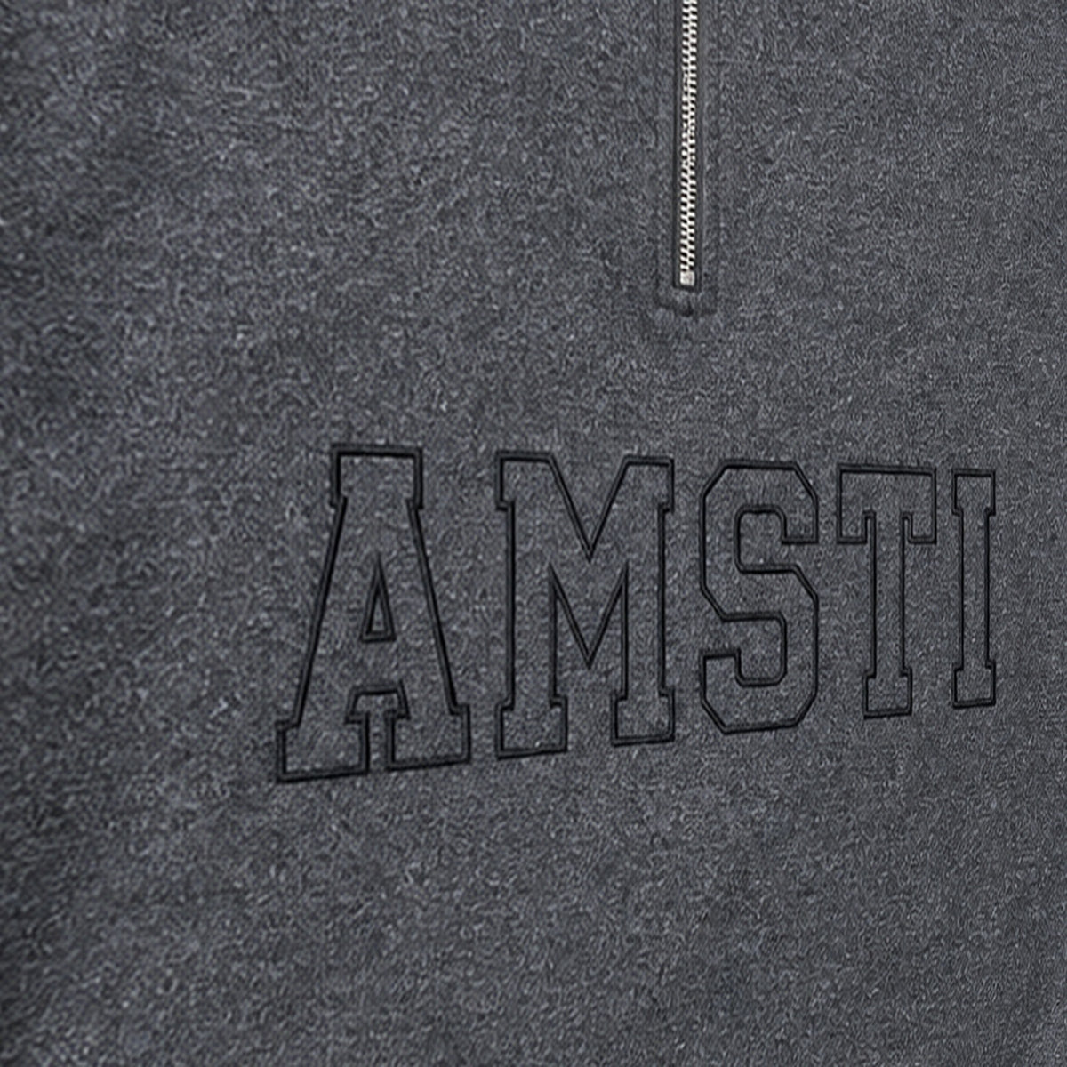 tonal block outline quarter zip embroidery close-up