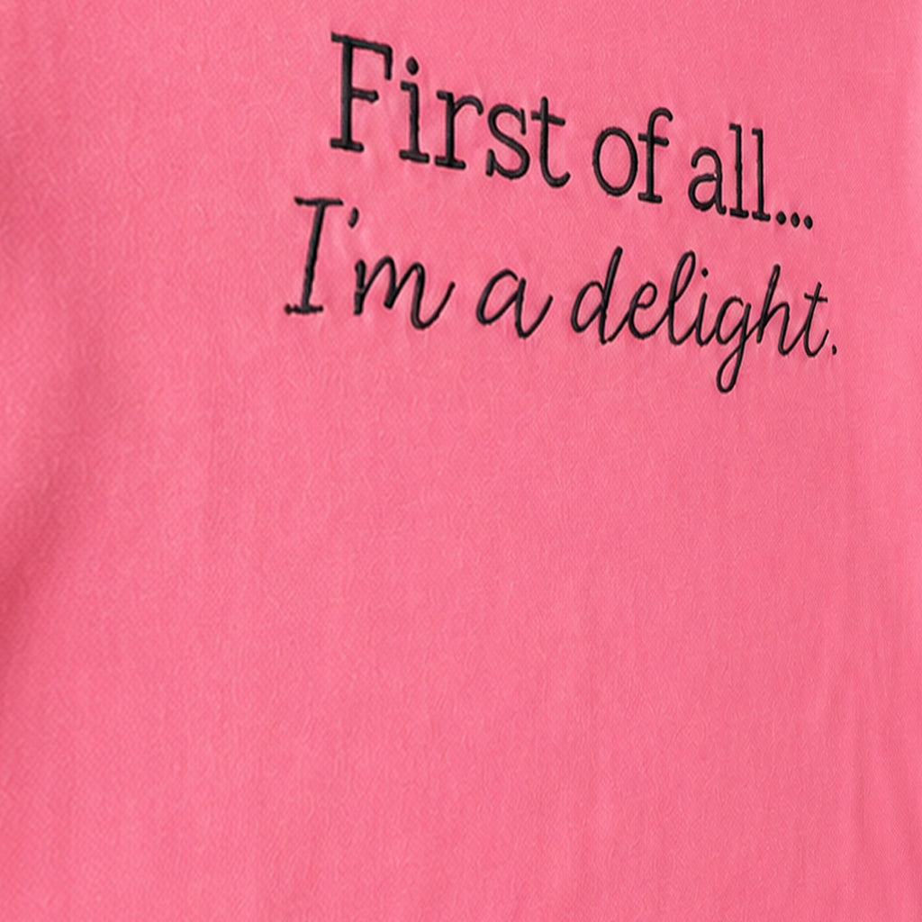 Close-up of the embroidered design on a custom two line embroidered saying long sleeve shirt