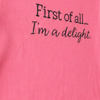 Close-up of the embroidered design on a custom two line embroidered saying long sleeve shirt