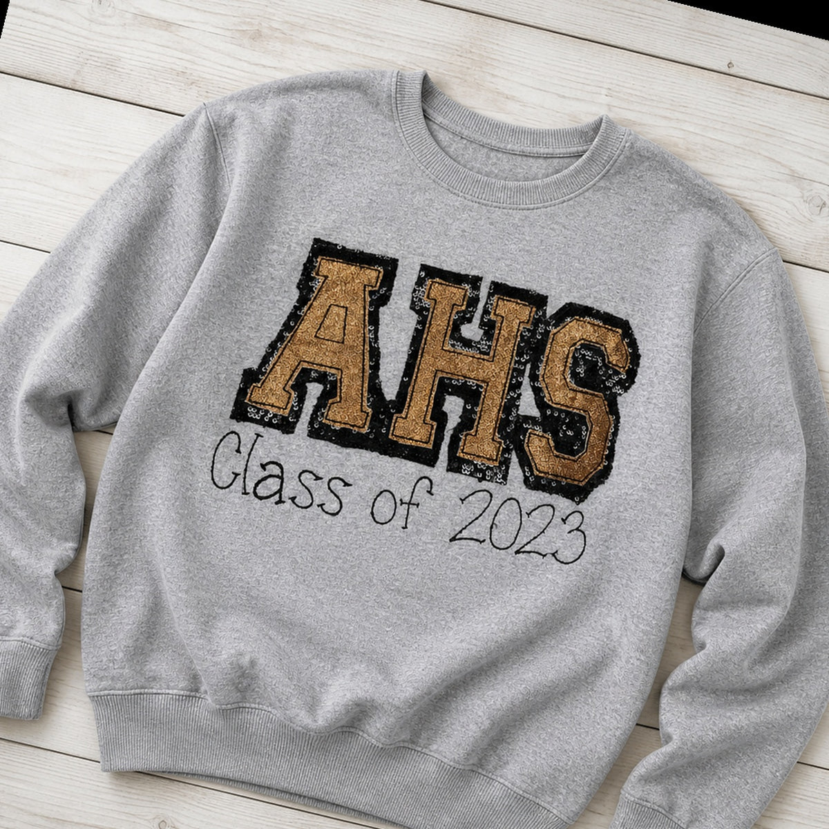 varsity graduation crewneck styled flat lay