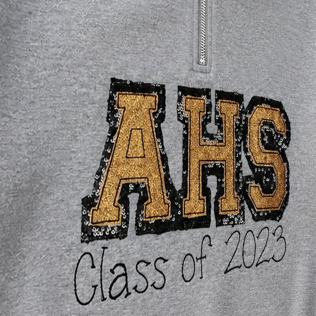 varsity graduation quarter zip embroidery close-up