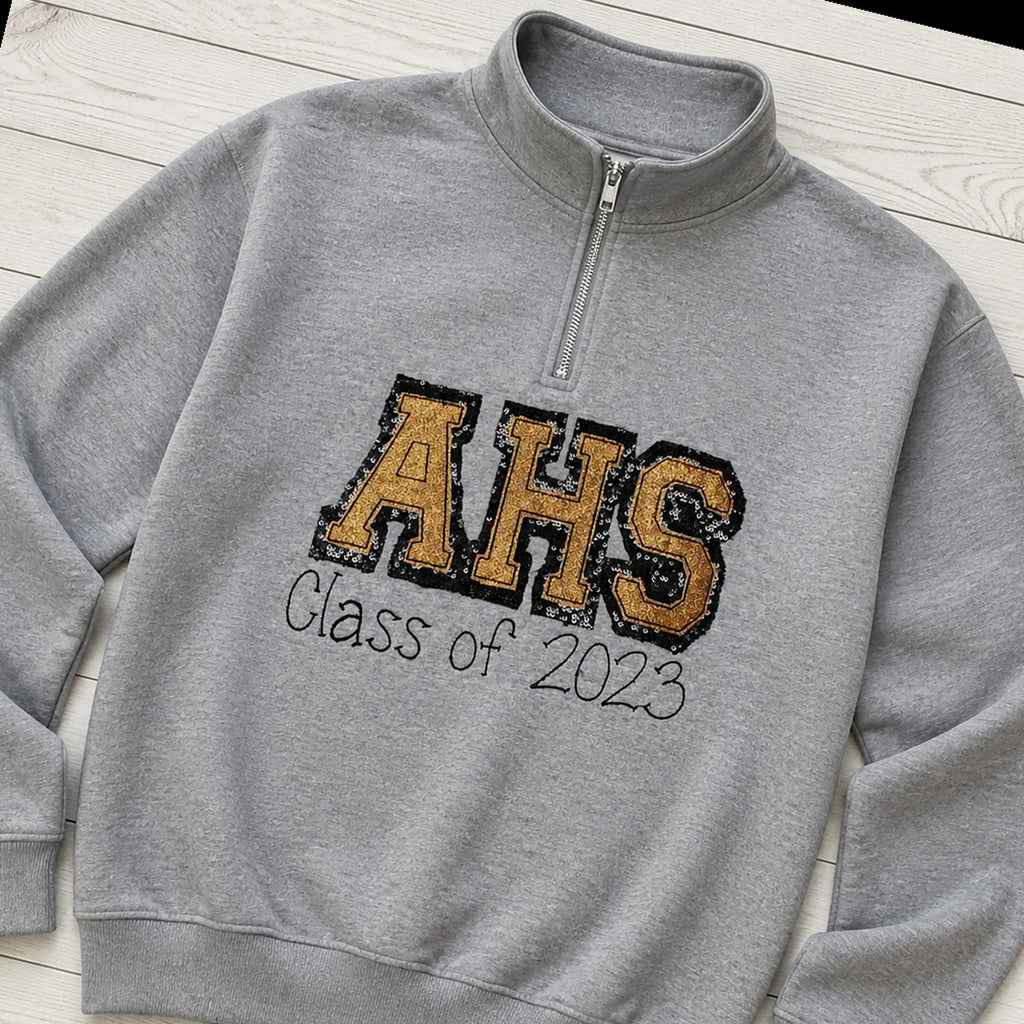 varsity graduation quarter zip styled flat lay