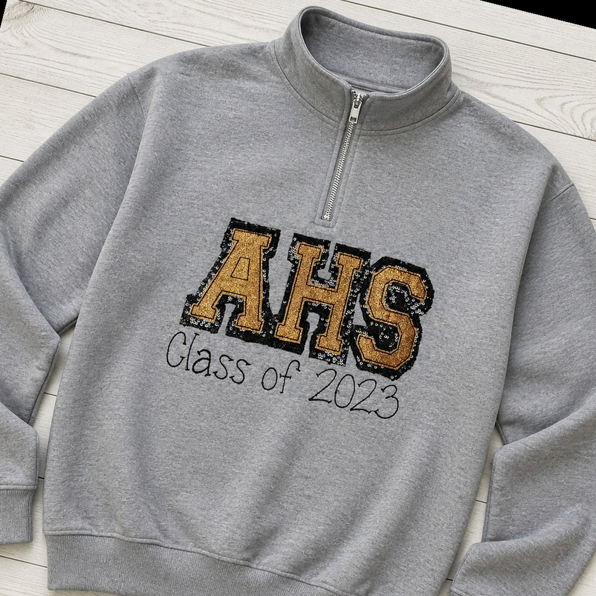 varsity graduation quarter zip styled flat lay