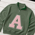 Custom varsity initial applique quarter zip pullover folded flat lay