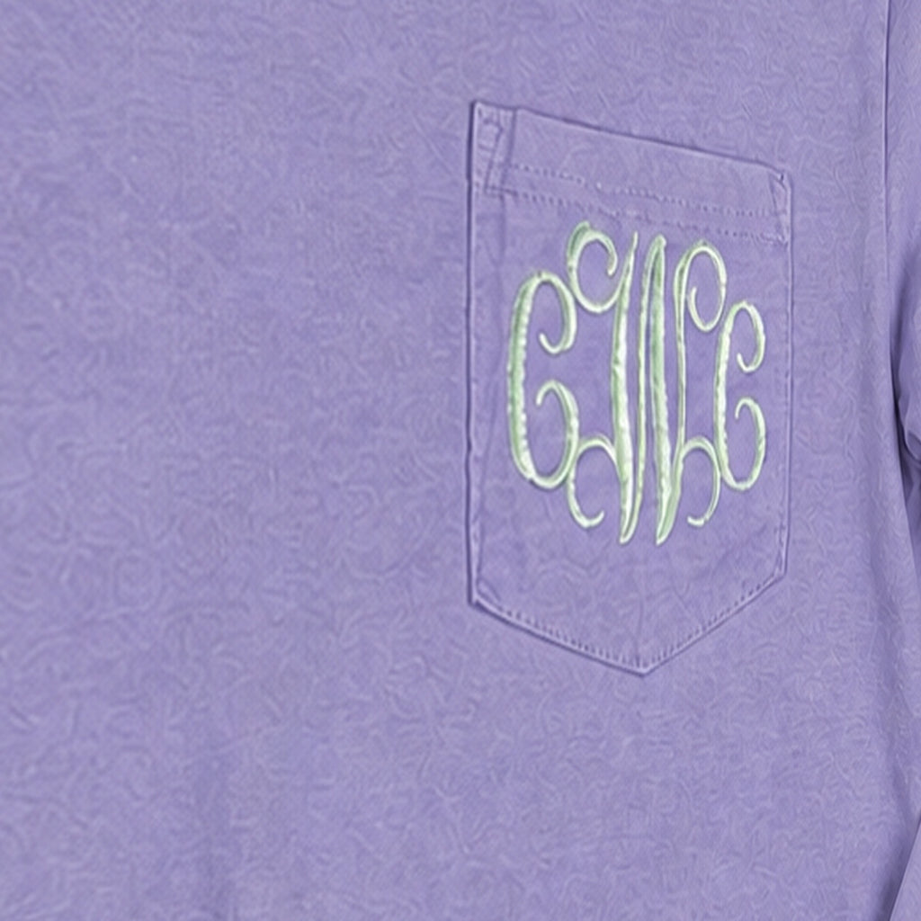 Close-up of the embroidered design on a custom vine monogram long sleeve pocket tee