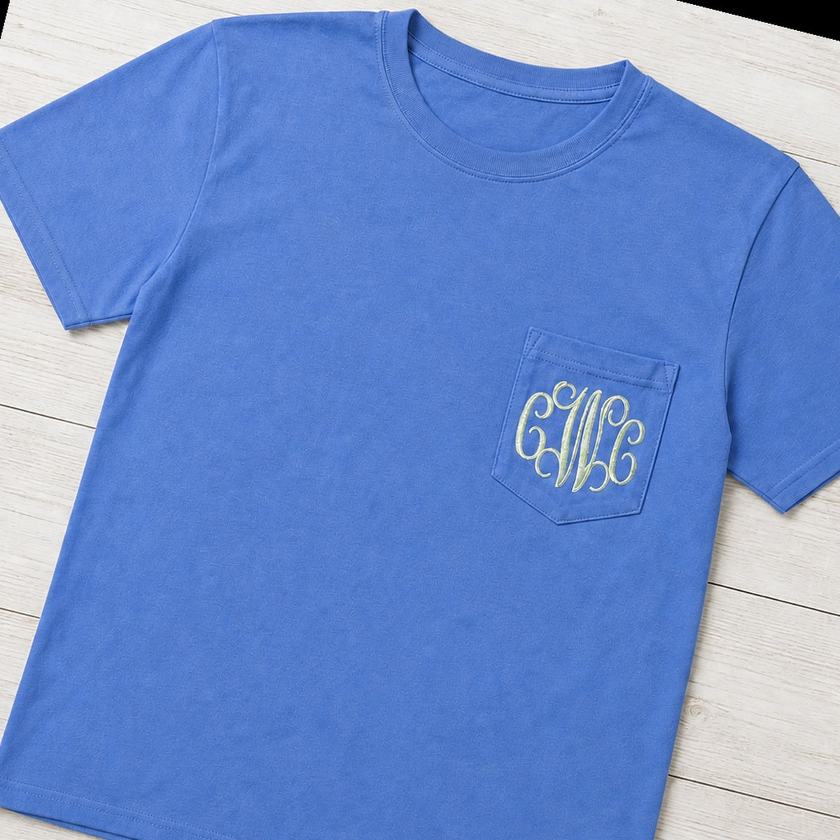 Vine monogram pocket tee folded flat lay