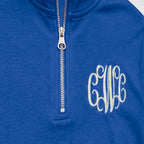 Close-up of the embroidered design on a custom vine monogram quarter zip pullover