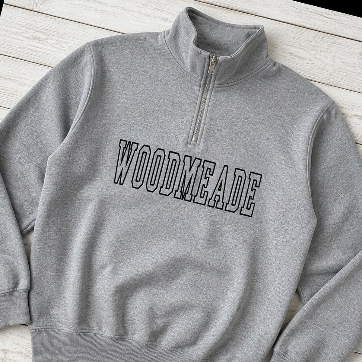 woodmeade outline quarter zip styled flat lay